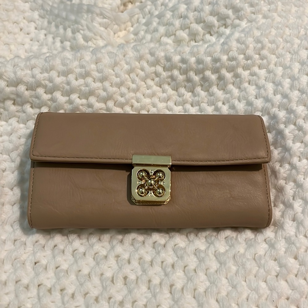 Beige and gold clutch.